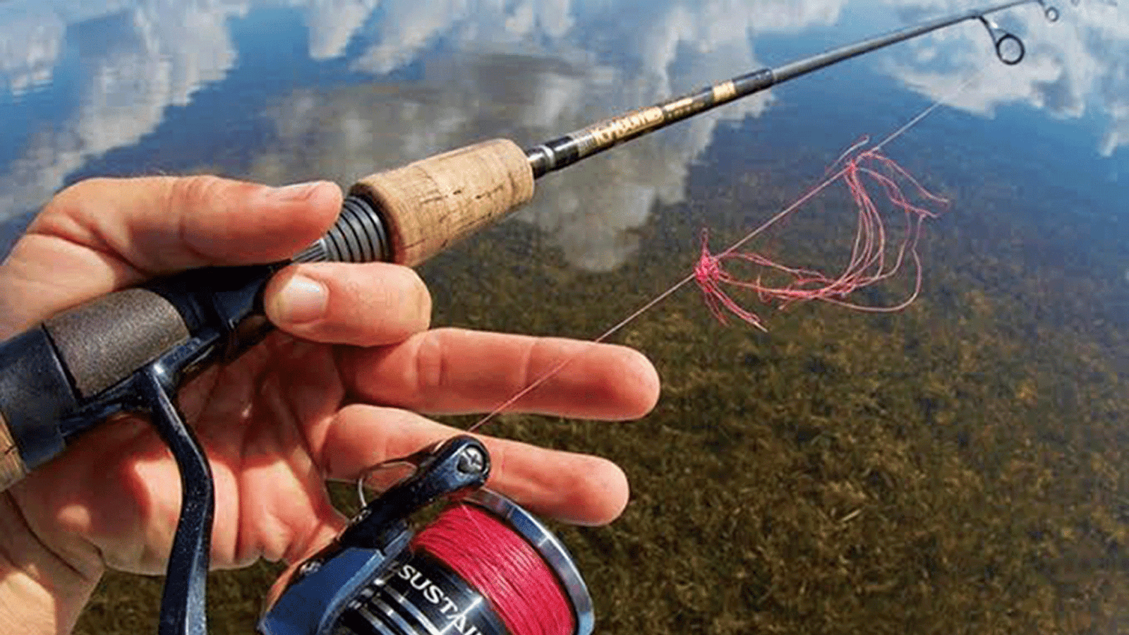 Braided fishing line wind knot tangle on a spinning reel ready for line management fixes